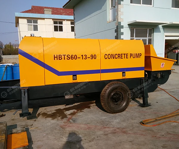 Electric trailer-mounted concrete pump with motor and control cabinet